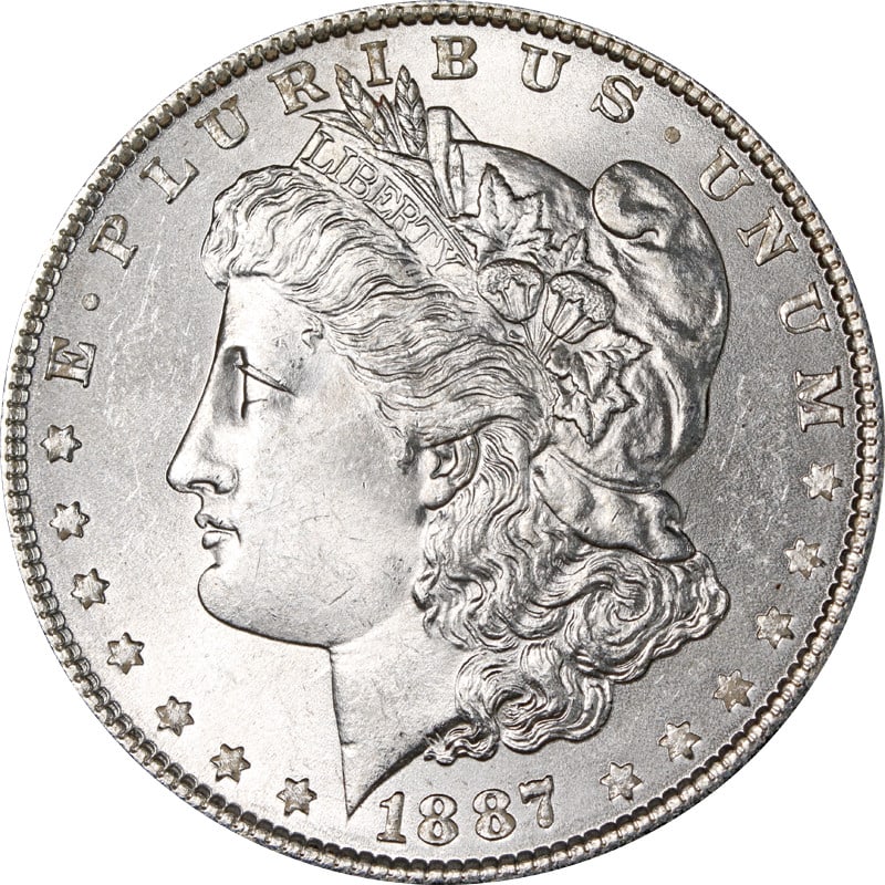VAM 5 1887 Philadelphia Morgan Silver Dollar with Doubled Date Variety: VAM 5 1887 Philadelphia Morgan Silver Dollar with Doubled Date Variety This is an 1887-P Morgan Silver Dollar featuring the VAM 5 variety, known for its doubled date. The coin is composed of 90% silve