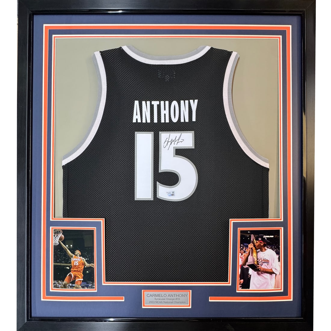 Framed Signed Carmelo Anthony Jersey 33x42 with Fanatics COA: Framed Signed Carmelo Anthony Jersey 33x42 with Fanatics COA This professionally framed and matted item features a Carmelo Anthony autographed Syracuse Orange jersey, measuring 35 inches by 39 inches.