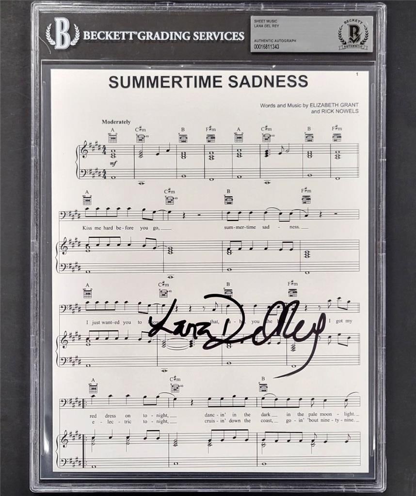 Lana Del Rey Signed Summertime Sadness 8x10 Music Sheet Beckett Authenticated: Lana Del Rey Signed Summertime Sadness 8x10 Music Sheet Beckett Authenticated This is an original 8x10 music song sheet for "Summertime Sadness" by Lana Del Rey, featuring her autograph. The item is a