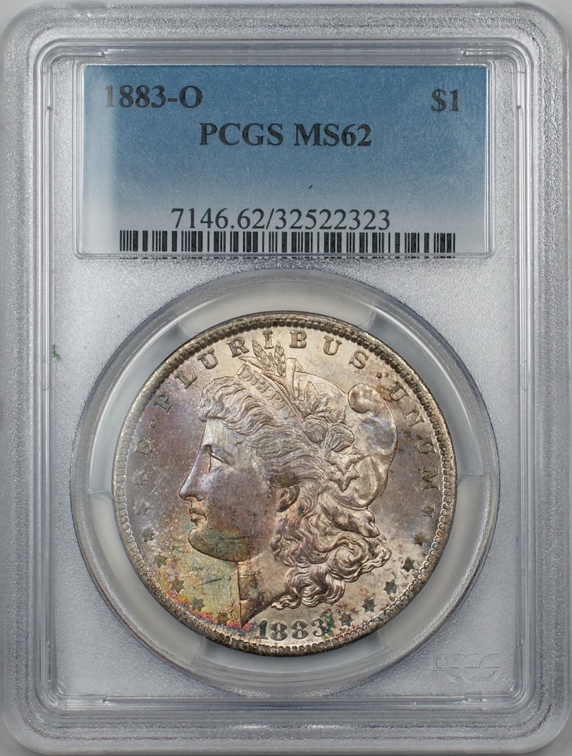 PCGS MS-62 Morgan Dollar 1883-O Silver Coin with Attractive Toning: PCGS MS-62 Morgan Dollar 1883-O Silver Coin with Attractive Toning This is an 1883-O Morgan Silver Dollar graded MS-62 by PCGS. The coin features attractive 5A toning and was minted in New Orleans. It