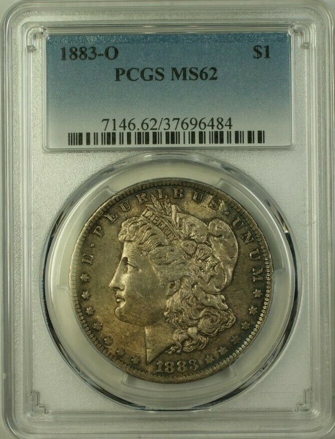 PCGS MS62 1883-O Morgan Dollar Silver Coin With Attractive Toning: PCGS MS62 1883-O Morgan Dollar Silver Coin With Attractive Toning This is an 1883-O Morgan Silver Dollar graded MS-62 by PCGS. Minted in New Orleans, this uncirculated coin features natural toning and