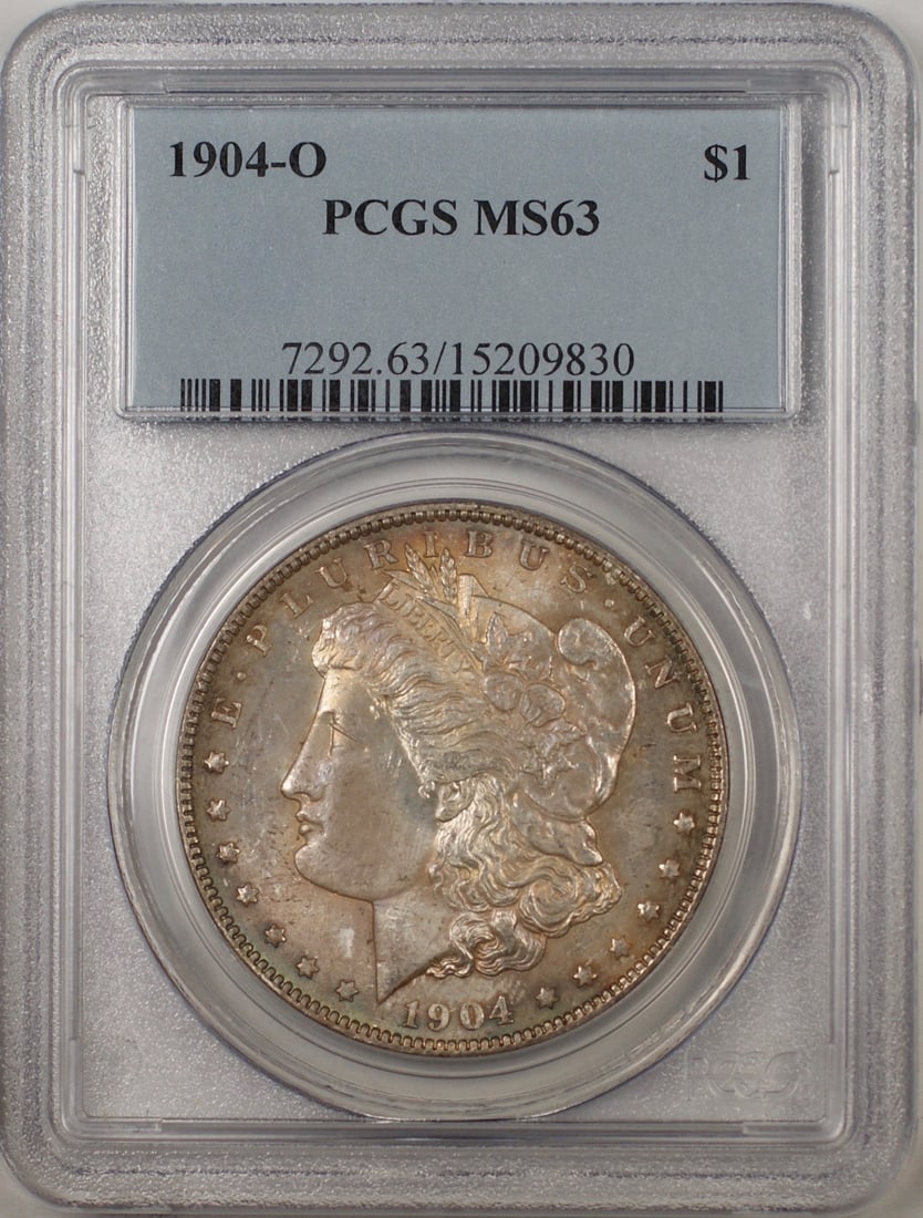 PCGS MS63 1904-O Morgan Silver Dollar New Orleans Mint Toned Uncirculated: PCGS MS63 1904-O Morgan Silver Dollar New Orleans Mint Toned Uncirculated This is a 1904-O Morgan Silver Dollar $1 coin, certified by PCGS with a grade of MS 63. The coin is uncirculated and features
