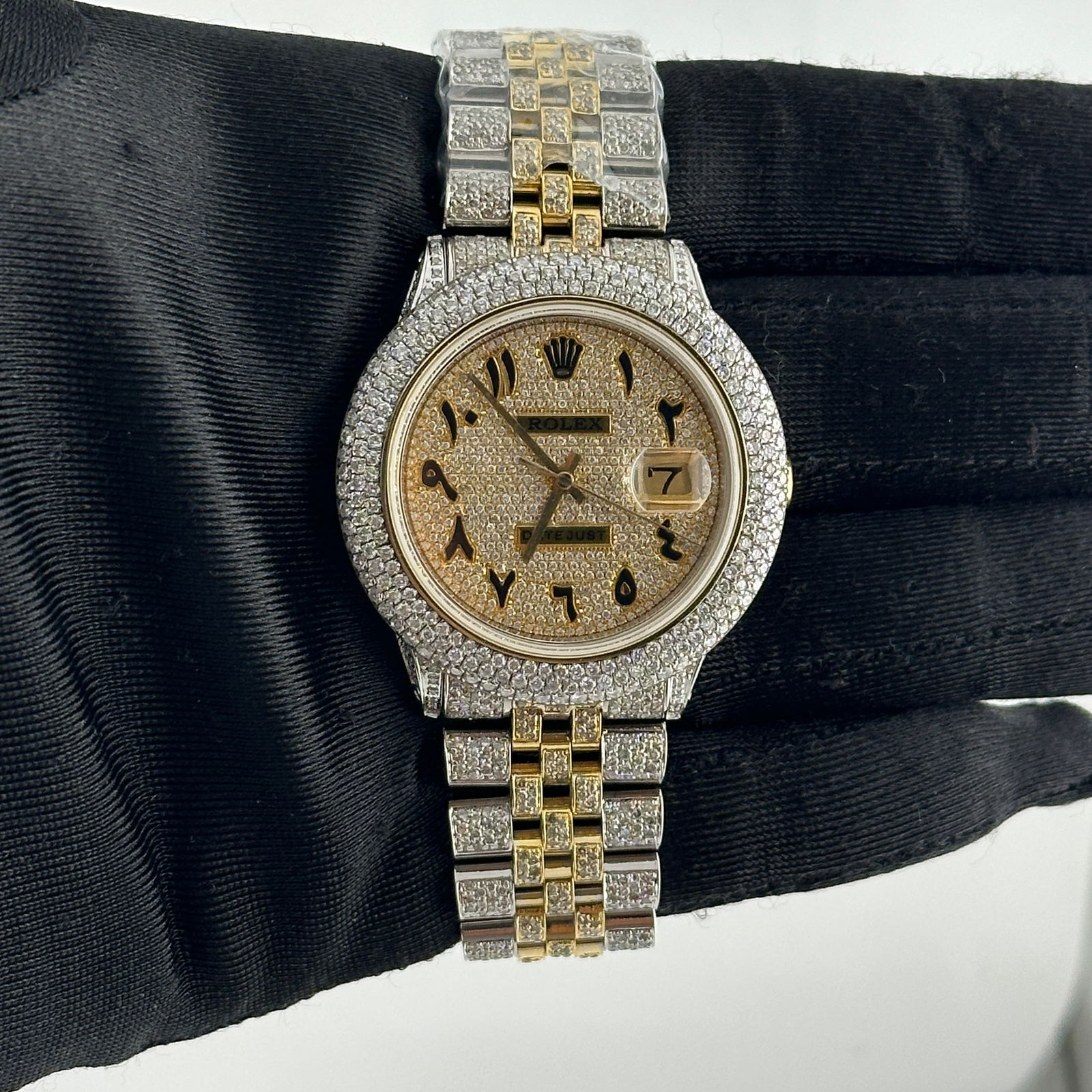 Datejust Ref 1601 Mens Watch with Iced Out Arabic Dial and Aftermarket Jubilee Bracelet: Datejust Ref 1601 Mens Watch with Iced Out Arabic Dial and Aftermarket Jubilee Bracelet This Rolex Datejust features an iced out Arabic dial, complemented by a 3-row bubble diamond plated bezel and an