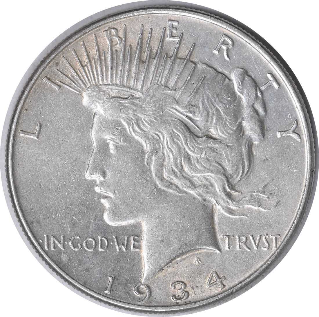 1934 Peace Silver Dollar AU Uncertified 90% Silver by Anthony de Francisci: 1934 Peace Silver Dollar AU Uncertified 90% Silver by Anthony de Francisci This 1934 Peace Silver Dollar is a remarkable piece for collectors and enthusiasts alike. Struck at the Philadelphia Mint, th