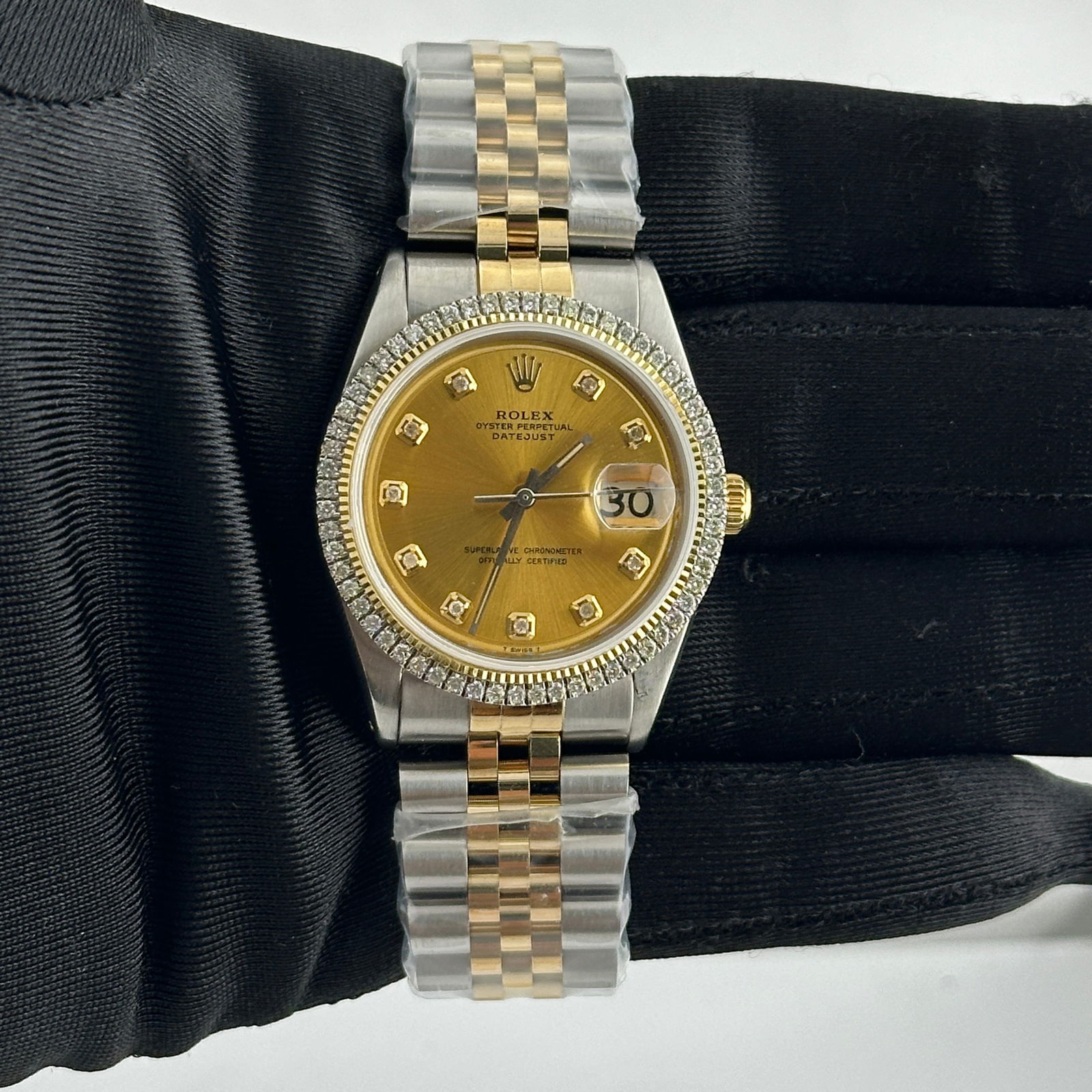Ref 1601 Rolex Datejust with Aftermarket Champagne Diamond Dial Jubilee Bracelet: Ref 1601 Rolex Datejust with Aftermarket Champagne Diamond Dial Jubilee Bracelet This Rolex Datejust features a champagne diamond dial and is fitted with an aftermarket Jubilee bracelet. The watch inc
