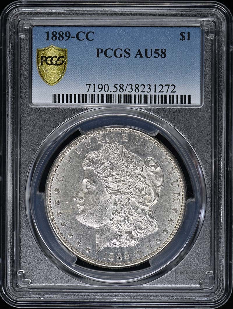1889-CC Morgan Dollar PCGS AU58 Certified Coin: 1889-CC Morgan Dollar PCGS AU58 Certified Coin This 1889-CC Morgan Dollar is a classic piece of American numismatic history. Graded AU58 by PCGS, it showcases a high level of detail with only slight s