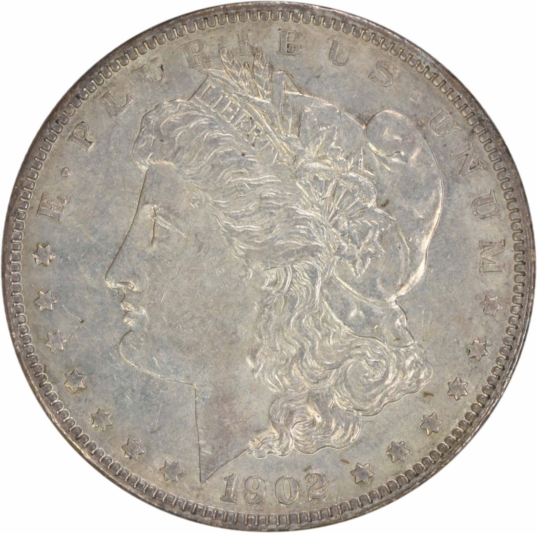 1902 Morgan Silver Dollar AU Uncertified Philadelphia Mint Coin: 1902 Morgan Silver Dollar AU Uncertified Philadelphia Mint Coin This 1902 Morgan Silver Dollar is an excellent addition for any coin collector. It features a beautiful design by George T. Morgan and i