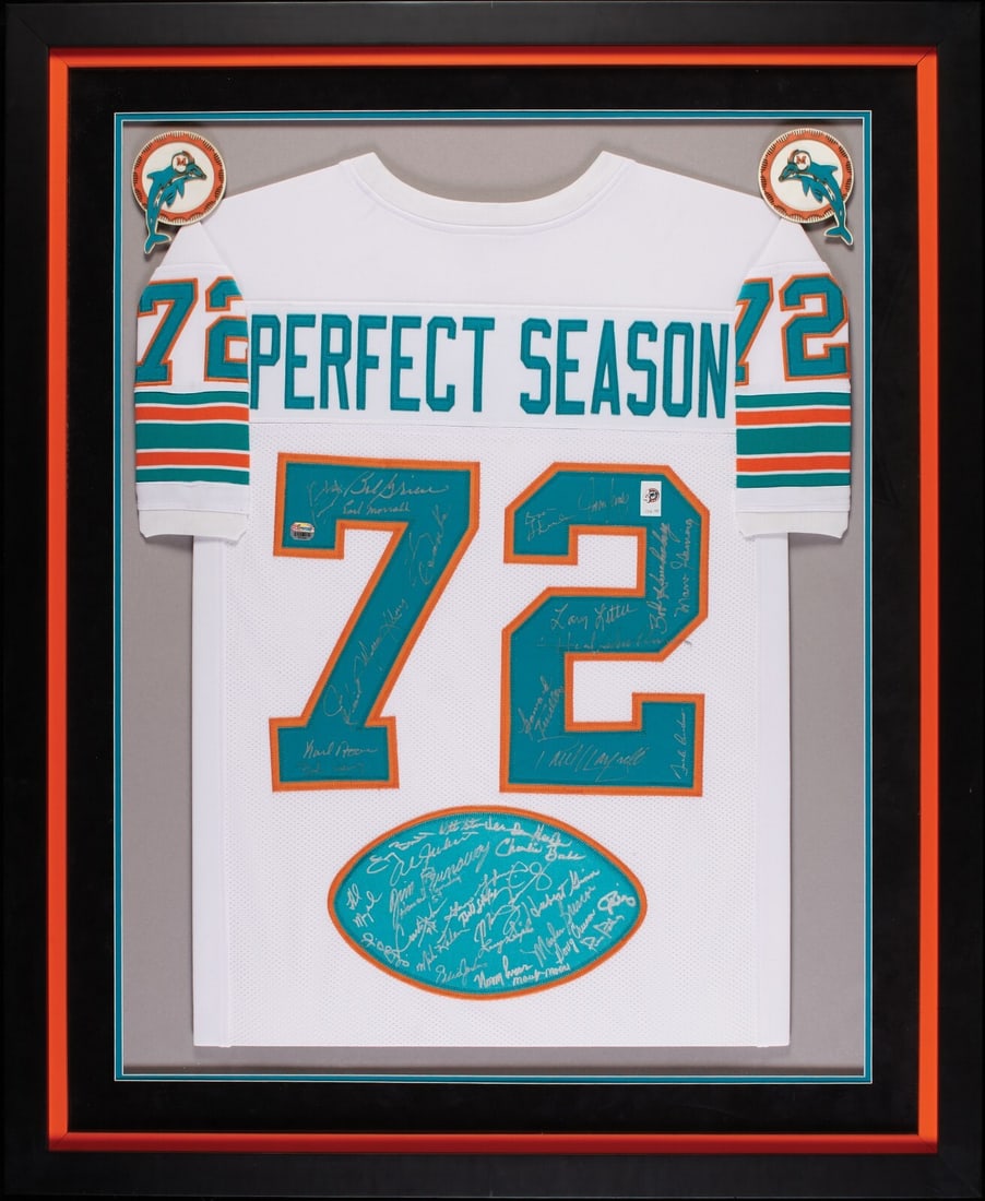 1972 Miami Dolphins Signed Jersey Framed Beckett Authenticated 37 Signatures: 1972 Miami Dolphins Signed Jersey Framed Beckett Authenticated 37 Signatures Celebrate the historic 1972 Miami Dolphins Perfect Season with this original team-signed jersey, expertly framed and matted