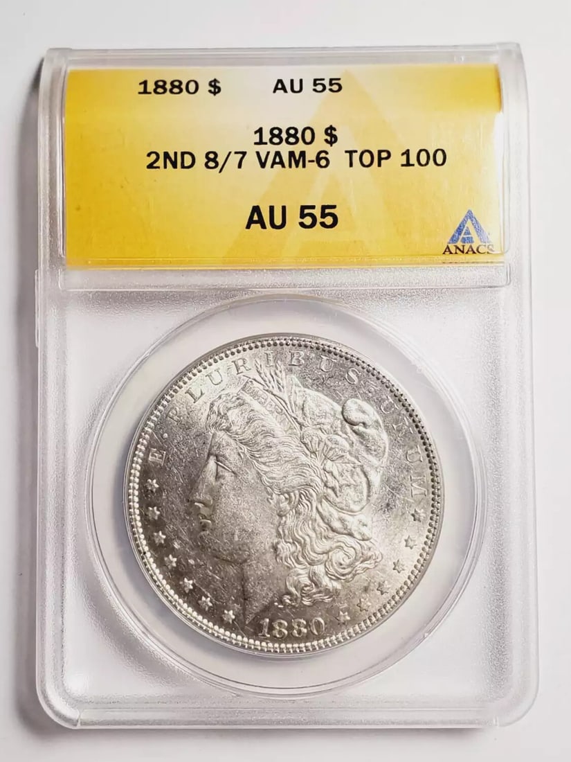 1880 Morgan Dollar ANACS AU 55 Silver Coin VAM 6: 1880 Morgan Dollar ANACS AU 55 Silver Coin VAM 6 This 1880 Morgan Dollar is a stunning piece certified by ANACS with a grade of AU 55. Minted in Philadelphia, this silver coin boasts a rich history an