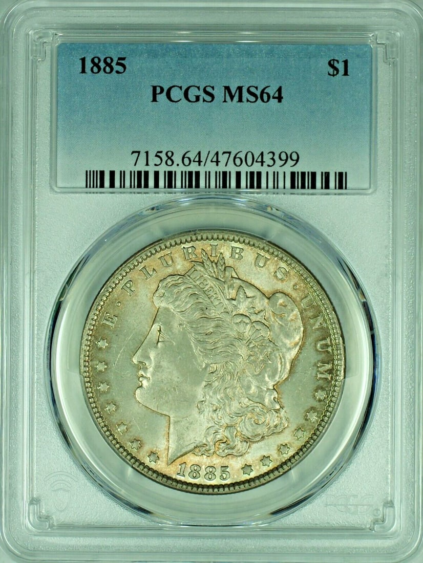 PCGS MS64 1885 Morgan Silver Dollar Toned Uncirculated US Coin: PCGS MS64 1885 Morgan Silver Dollar Toned Uncirculated US Coin This 1885 Morgan Silver Dollar is an uncirculated coin certified by PCGS with a grade of MS 64. The coin features a toned appearance and