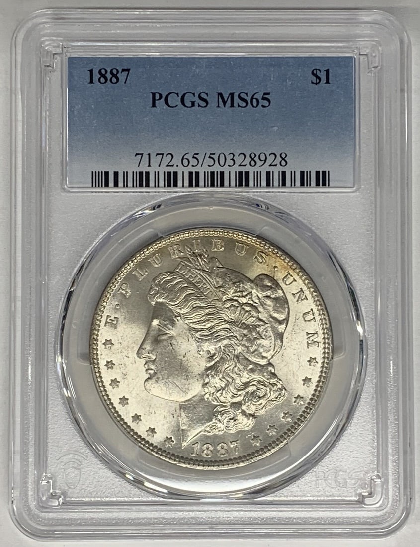 PCGS MS 65 Certified 1887 Silver Morgan Dollar Coin: PCGS MS 65 Certified 1887 Silver Morgan Dollar Coin This is an 1887 Morgan Silver Dollar coin from the United States, certified by PCGS with a grade of MS 65. The coin is composed of silver, has a den