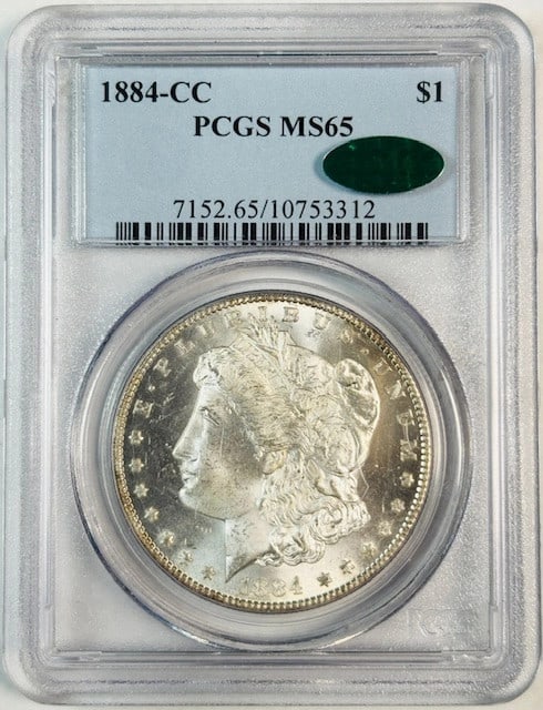 PCGS MS-65 CAC 1884 Carson City Morgan Silver Dollar: PCGS MS-65 CAC 1884 Carson City Morgan Silver Dollar This 1884 Carson City Morgan Silver Dollar is graded MS-65 by PCGS and CAC certified. Struck in silver, this uncirculated coin originates from the