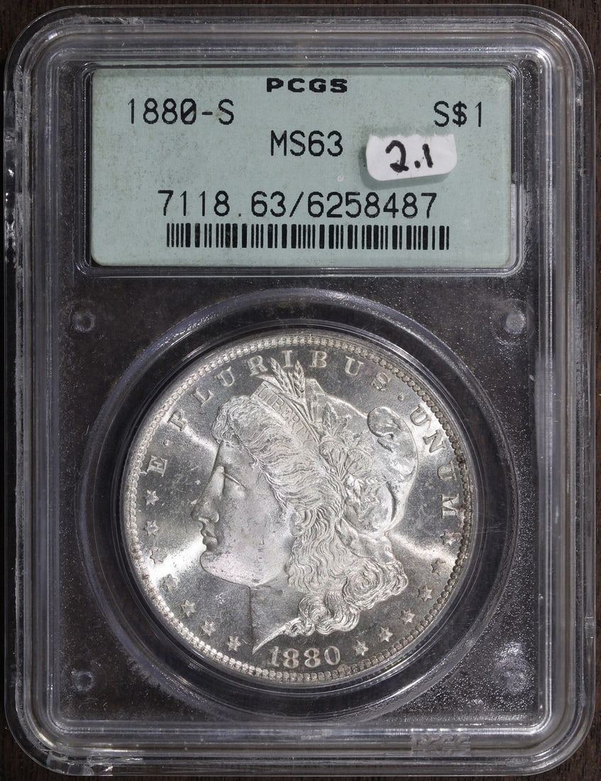 PCGS MS63 1880 San Francisco Morgan Silver Dollar OGH Gen 2.1: PCGS MS63 1880 San Francisco Morgan Silver Dollar OGH Gen 2.1 This is an un-used 1880-S Morgan Silver Dollar graded MS63 by PCGS and housed in an Old Green Holder (Generation 2.1). Minted in San Franc