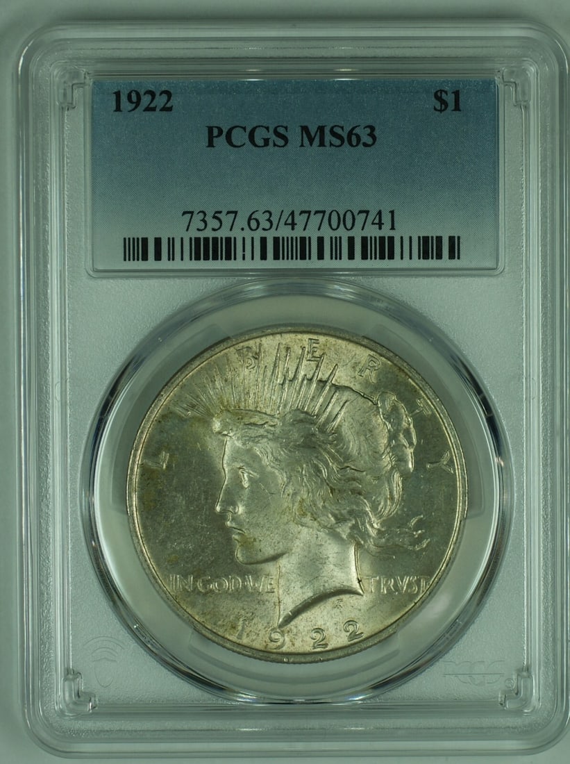 PCGS MS 63 1922 Peace Silver Dollar Coin with Toned Finish: PCGS MS 63 1922 Peace Silver Dollar Coin with Toned Finish This is a 1922 Peace Silver $1 Dollar Coin from the United States, featuring attractive toning. The coin is uncirculated and has been graded