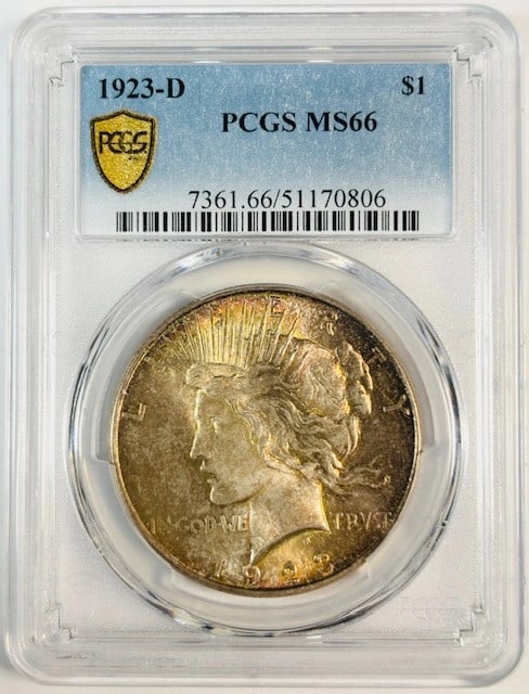 PCGS MS66 1923 Denver Peace Silver Dollar with Vibrant Rainbow Toning: PCGS MS66 1923 Denver Peace Silver Dollar with Vibrant Rainbow Toning This 1923 D Peace Dollar is certified by PCGS with a grade of MS 66, indicating uncirculated condition. Struck at the Denver Mint,