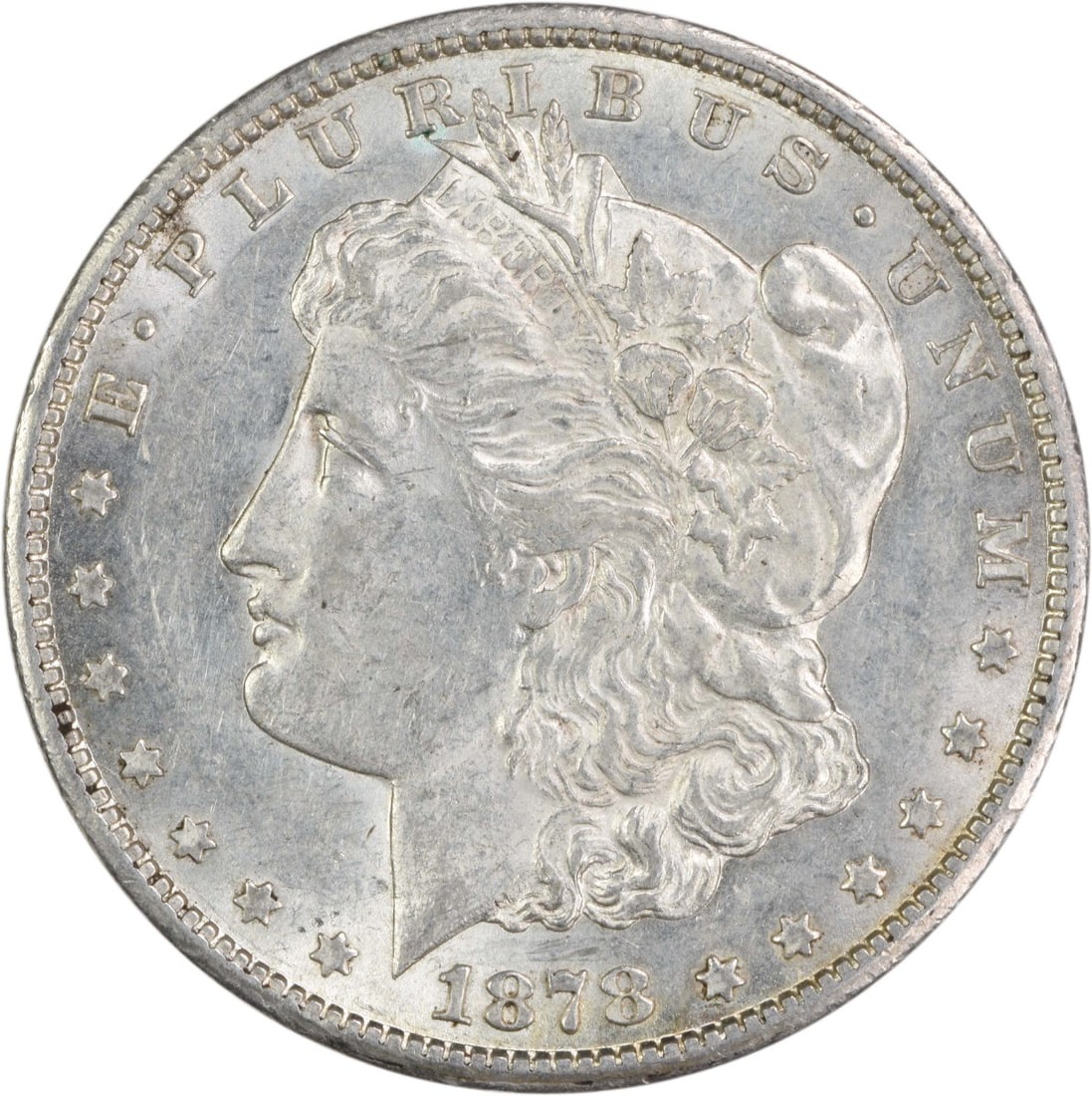 1878-CC Morgan Silver Dollar AU Uncertified Coin: 1878-CC Morgan Silver Dollar AU Uncertified Coin This 1878-CC Morgan Silver Dollar is a notable piece from the United States, featuring a design by George T. Morgan. It is in AU (About Uncirculated) c