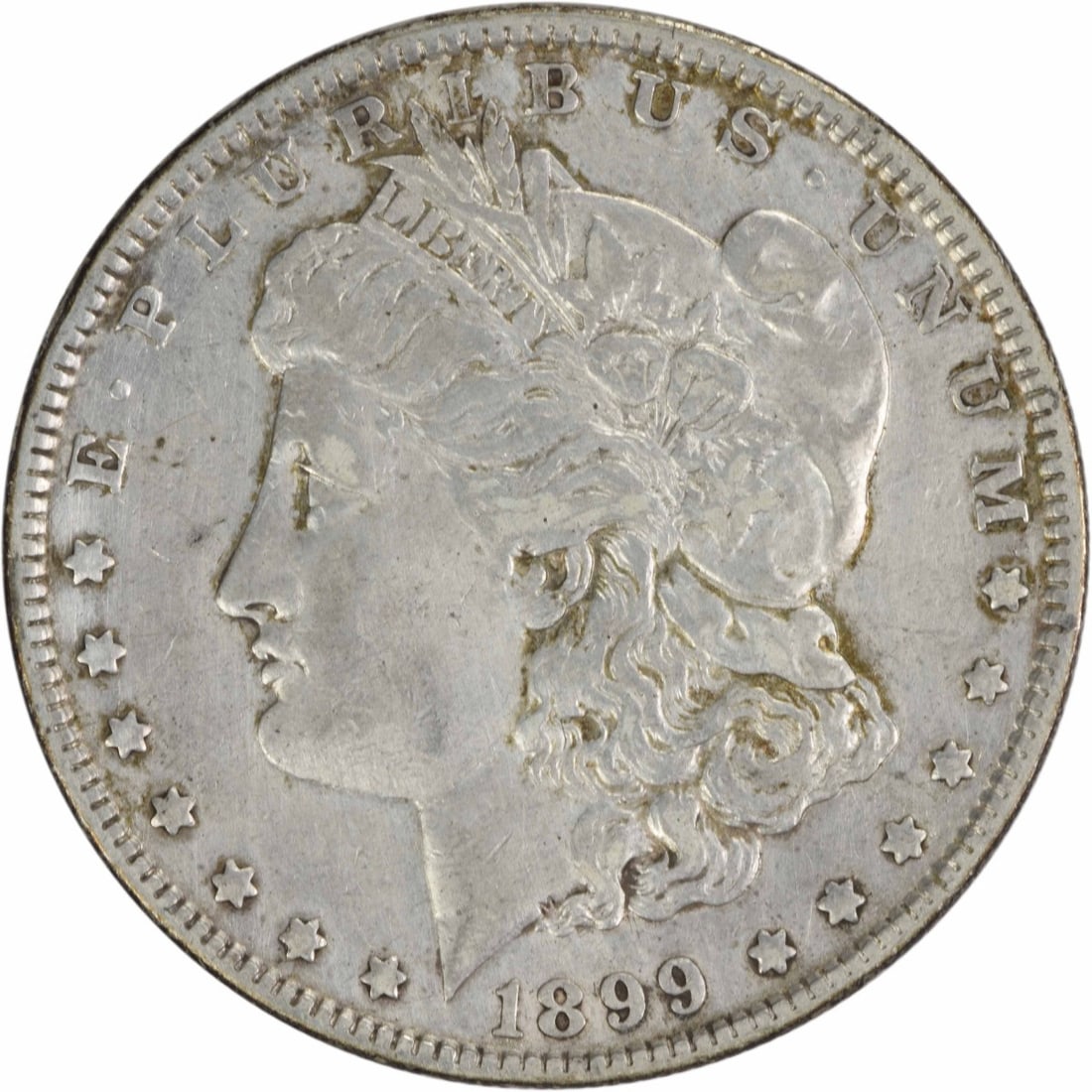 1899 Morgan Silver Dollar 90% Silver XF Uncertified Philadelphia Mint: 1899 Morgan Silver Dollar 90% Silver XF Uncertified Philadelphia Mint This 1899 Morgan Silver Dollar is an exquisite piece of American numismatic history. Crafted from 90% silver and 10% copper, this