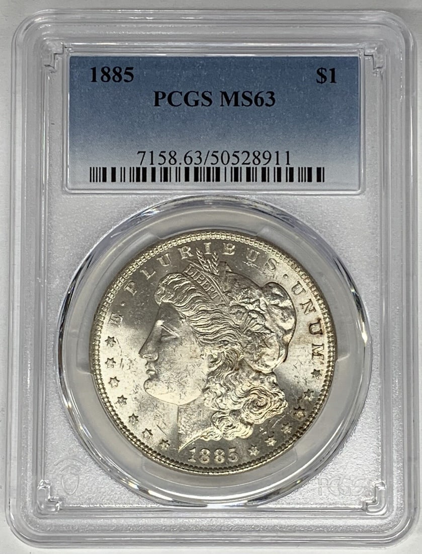 PCGS MS 63 Certified 1885 Morgan Silver Dollar Uncirculated $1 Coin: PCGS MS 63 Certified 1885 Morgan Silver Dollar Uncirculated $1 Coin This 1885 Morgan Silver Dollar is certified by PCGS with a grade of MS 63. The coin is uncirculated and composed of silver, originat