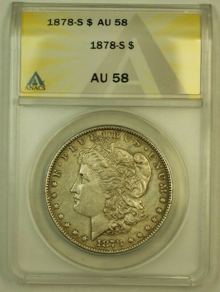 ANACS AU-58 1878-S Morgan Silver Dollar with SPL Toning: ANACS AU-58 1878-S Morgan Silver Dollar with SPL Toning This is a 1878-S Morgan Silver Dollar graded AU-58 by ANACS. Minted in San Francisco, this circulated coin is composed of 90% silver and has a d