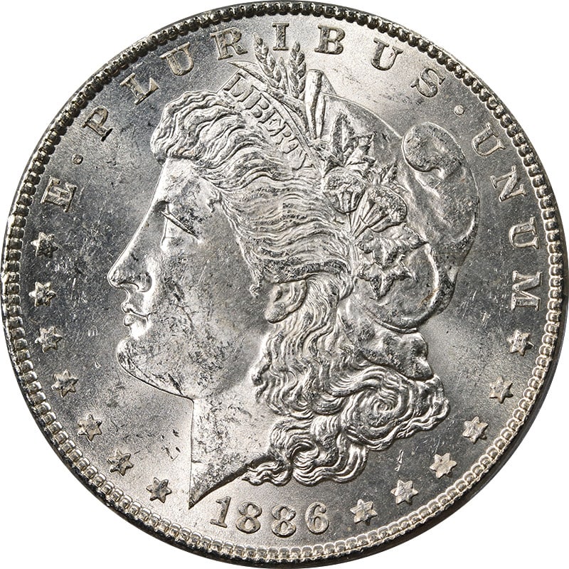 PCGS MS63 1886 Morgan Dollar VAM 21 MPD 8 Below M Silver Coin: PCGS MS63 1886 Morgan Dollar VAM 21 MPD 8 Below M Silver Coin This original 1886-P Morgan Silver Dollar features the VAM 21 MPD, 8 Below M variety. Graded PCGS MS63, it offers outstanding eye appeal w