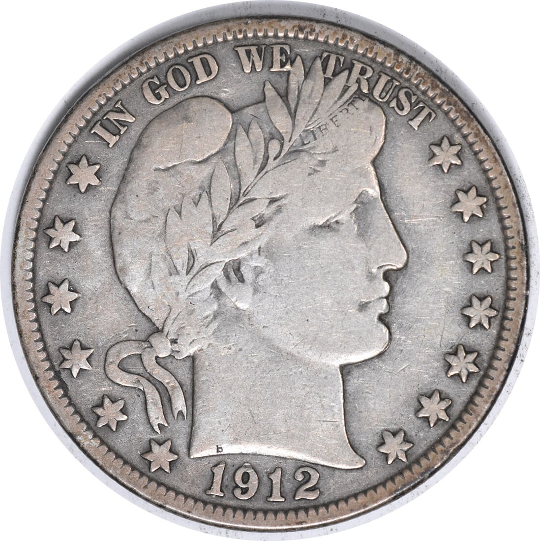1912-S Barber Half Dollar 50C Silver VF Circulated Coin: 1912-S Barber Half Dollar 50C Silver VF Circulated Coin This 1912-S Barber Silver Half Dollar is a remarkable piece of numismatic history, renowned for its classic design by Charles E. Barber. Struck