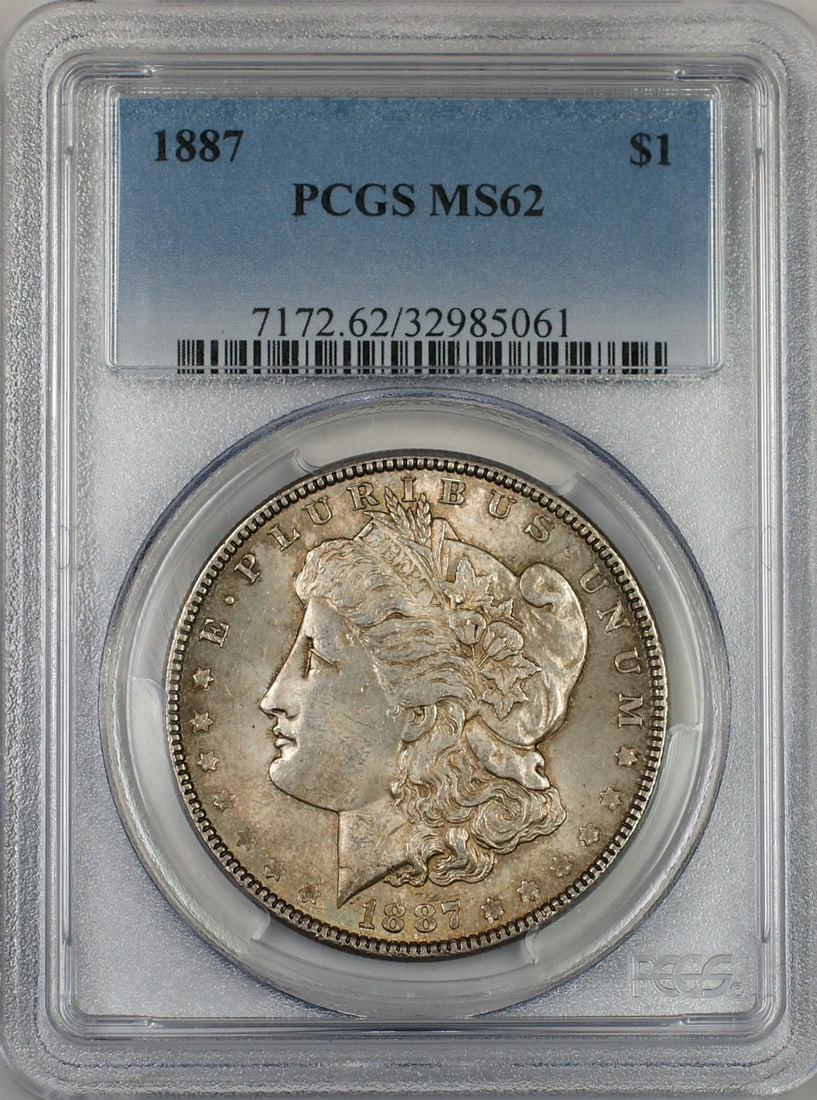 PCGS MS62 1887 Silver Morgan Dollar Philadelphia Toned: PCGS MS62 1887 Silver Morgan Dollar Philadelphia Toned This 1887 Morgan Silver Dollar is a $1 coin graded MS-62 by PCGS. The coin, composed of silver, was minted in Philadelphia and features attractiv