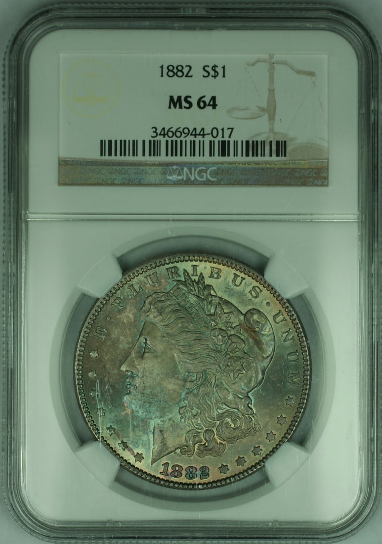 NGC MS-64 1882 Morgan Dollar Silver Coin With Attractive Toning: NGC MS-64 1882 Morgan Dollar Silver Coin With Attractive Toning This 1882 Morgan Silver Dollar features beautiful natural toning and has been certified by NGC with a grade of MS-64. Struck in Philadel