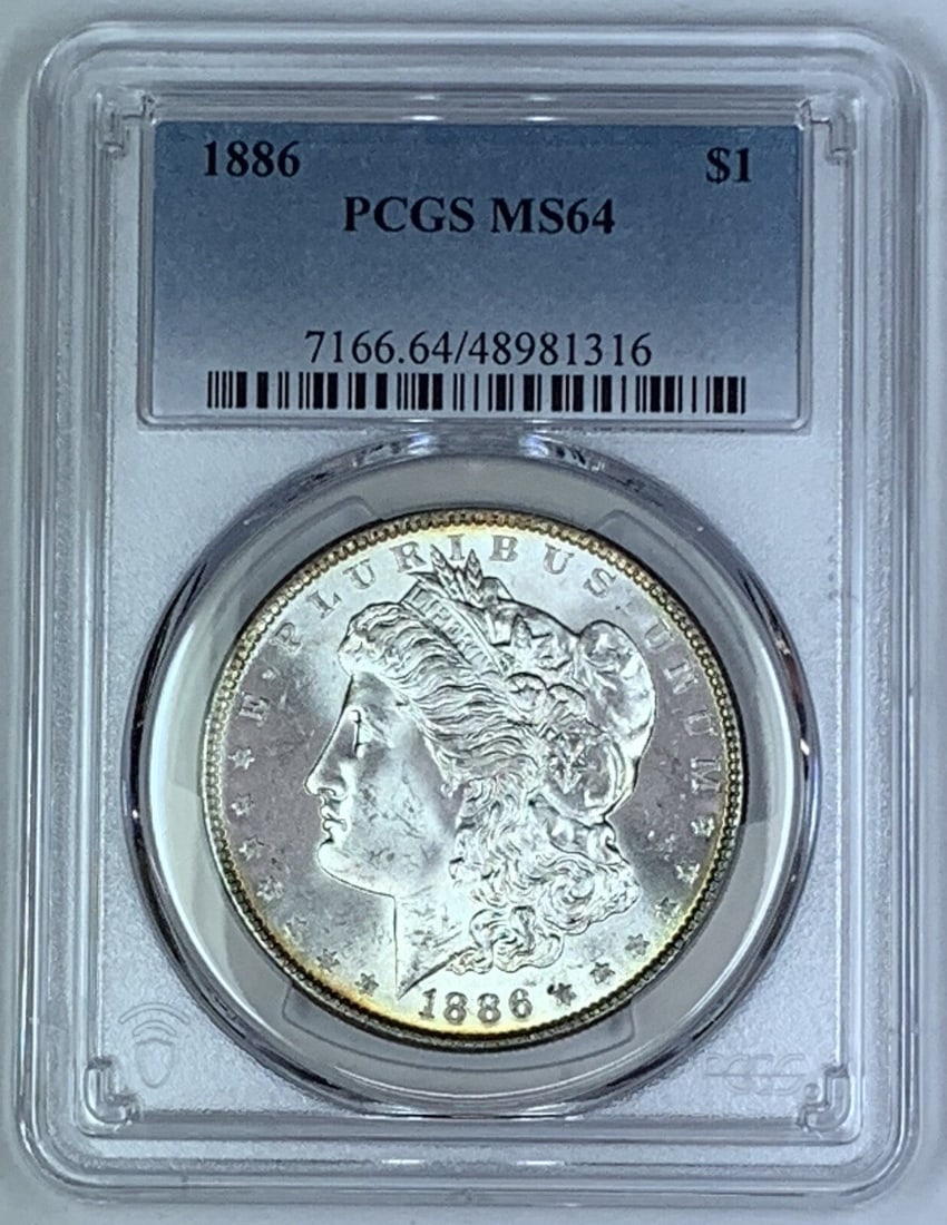 PCGS MS 64 1886 Morgan Silver Dollar United States $1 Coin: PCGS MS 64 1886 Morgan Silver Dollar United States $1 Coin This is an 1886 Morgan Silver $1 Dollar Coin, certified by PCGS with a grade of MS 64. The coin is uncirculated and composed of silver, repre