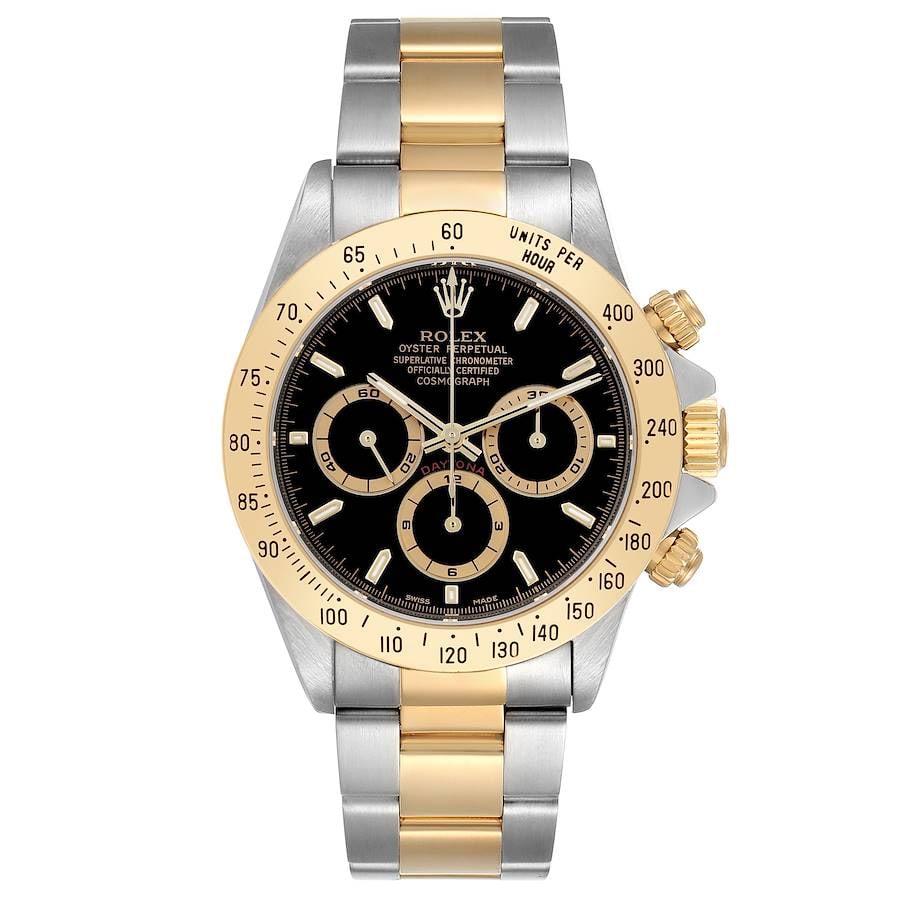 Daytona Ref 16523 Men's Watch Black Dial Oyster Bracelet Papers 1999: Daytona Ref 16523 Men's Watch Black Dial Oyster Bracelet Papers 1999 This Rolex Daytona features a black dial and is paired with a yellow gold bezel and an Oyster bracelet. The watch is a men's model