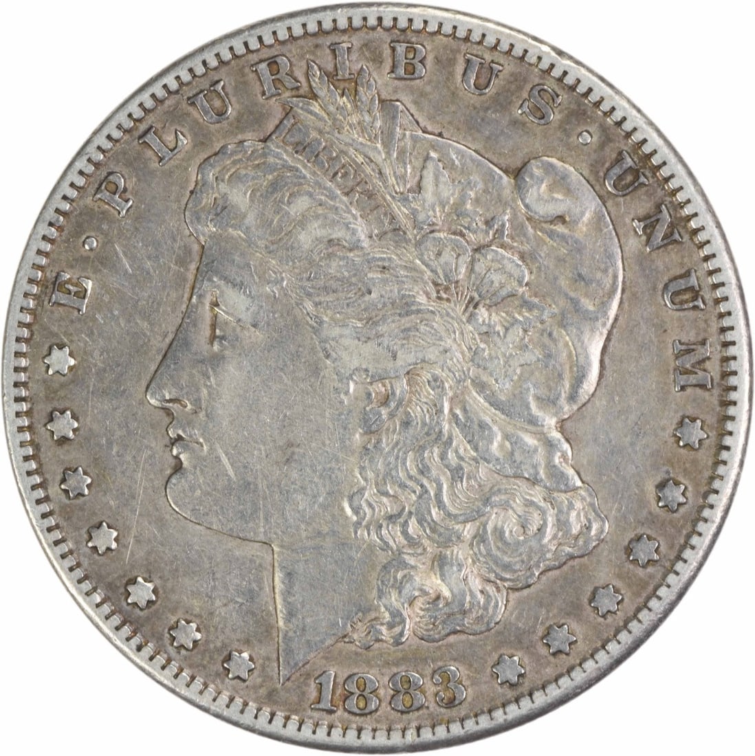 1883-S Morgan Silver Dollar XF Uncertified 90% Silver Coin: 1883-S Morgan Silver Dollar XF Uncertified 90% Silver Coin Introducing the 1883-S Morgan Silver Dollar, a classic piece of American coinage. This coin, designed by George T. Morgan, features a stunnin