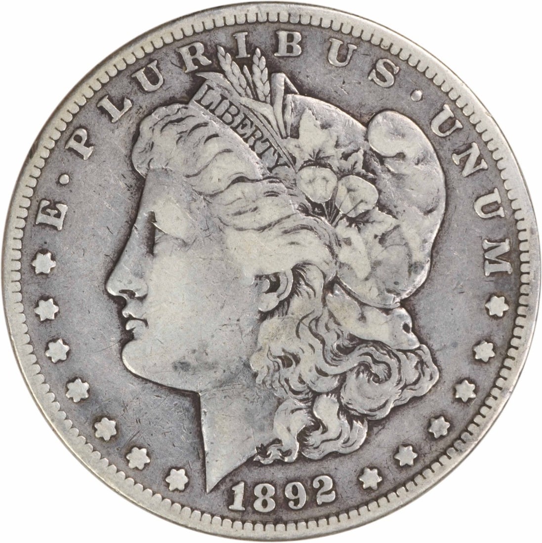 1892 CC Morgan Silver Dollar Choice F Uncertified 90% Silver: 1892 CC Morgan Silver Dollar Choice F Uncertified 90% Silver This 1892-CC Morgan Silver Dollar is a remarkable piece of American numismatic history, featuring the iconic design by George T. Morgan. Wi