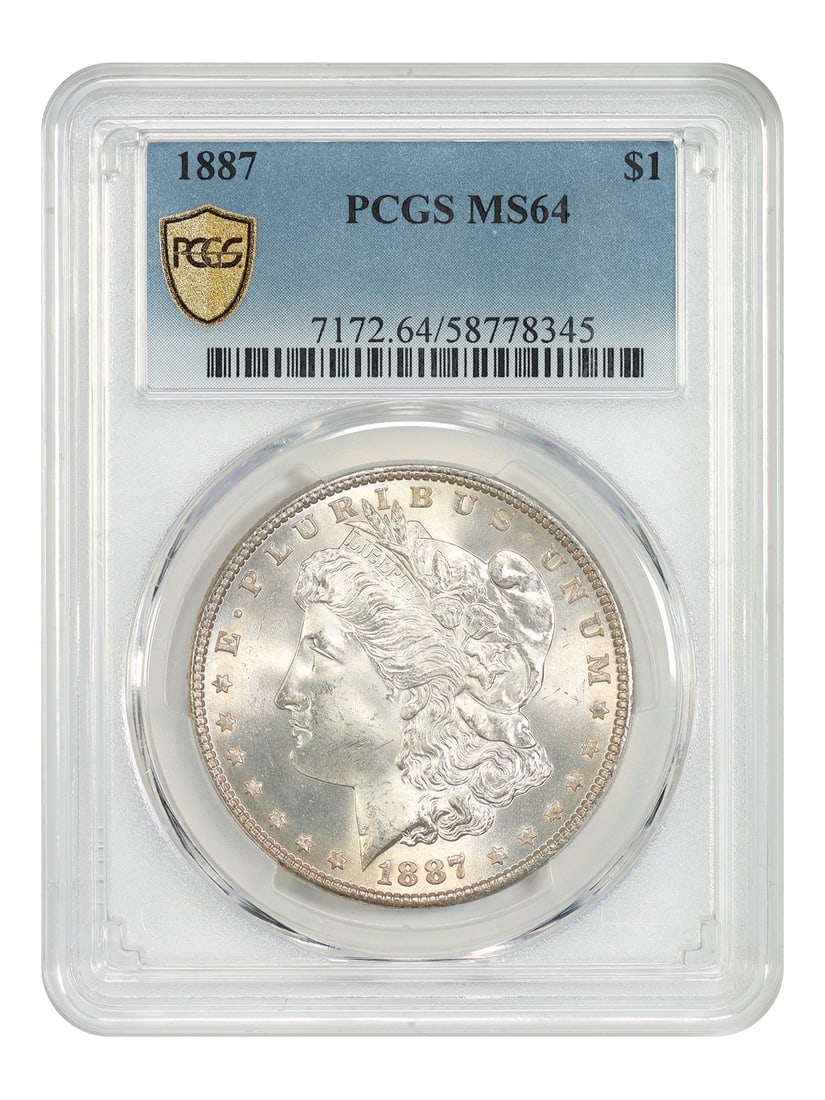 PCGS MS64 1887 Morgan Silver Dollar Coin: PCGS MS64 1887 Morgan Silver Dollar Coin This is an 1887 Morgan Dollar graded MS64 by PCGS. The coin is uncirculated and was minted in Philadelphia. It belongs to the Morgan Dollar series and is pre-o