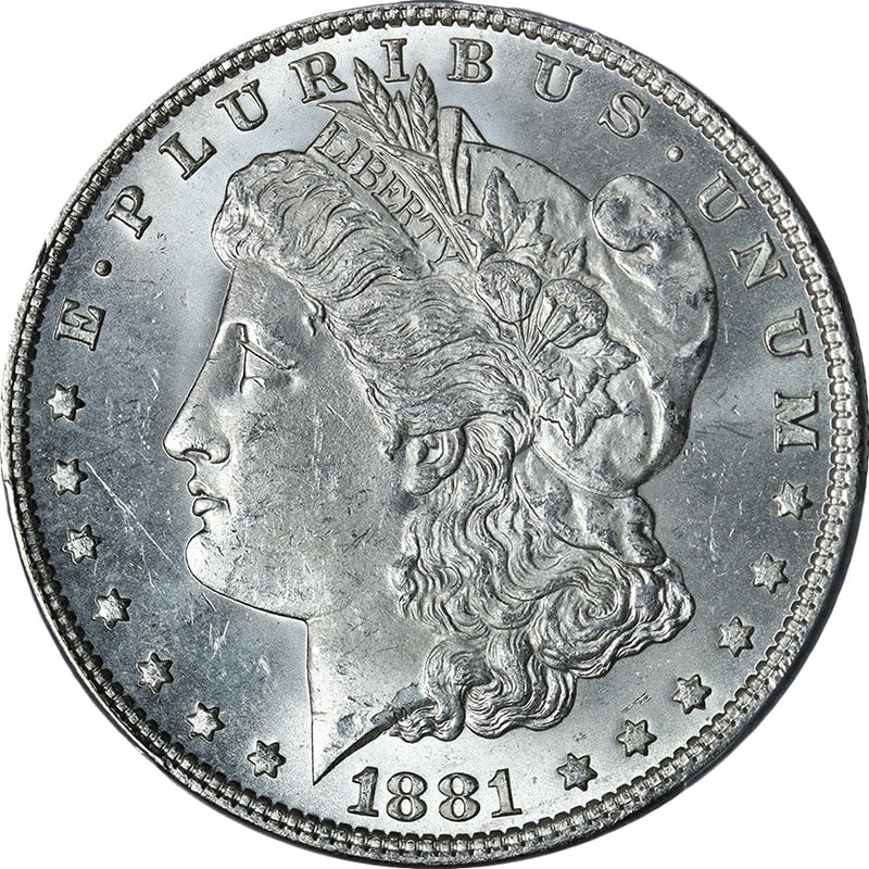 1881-P Morgan Silver Dollar PCGS MS63 Blast White Uncirculated: 1881-P Morgan Silver Dollar PCGS MS63 Blast White Uncirculated This stunning 1881-P Morgan Silver Dollar is graded PCGS MS63, showcasing exceptional eye appeal with brilliant luster and a sharp strike