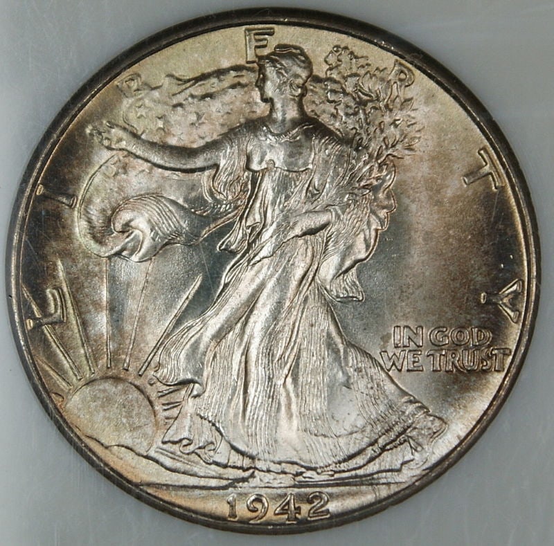 1942 Liberty Walking Half Dollar Silver Coin Uncirculated Light Toning: 1942 Liberty Walking Half Dollar Silver Coin Uncirculated Light Toning This 1942 Walking Liberty Half Dollar is a gem uncirculated coin with light toning. Struck in Philadelphia, it features a composi