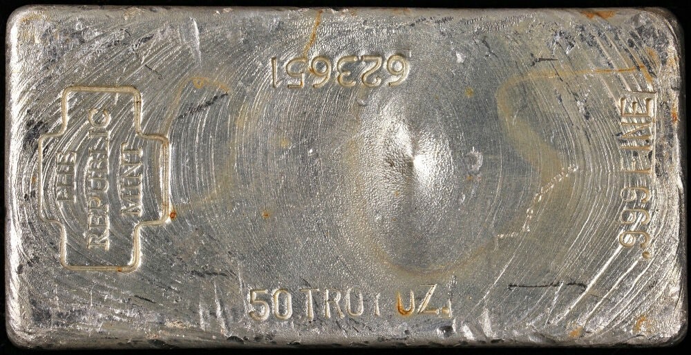 50 oz .999 Fine Silver Poured Bar by Republic Mint Vintage: 50 oz .999 Fine Silver Poured Bar by Republic Mint Vintage This is a vintage poured silver bar from Republic Mint with a weight of 50 ounces and a fineness of .999. The bar is composed of silver and f
