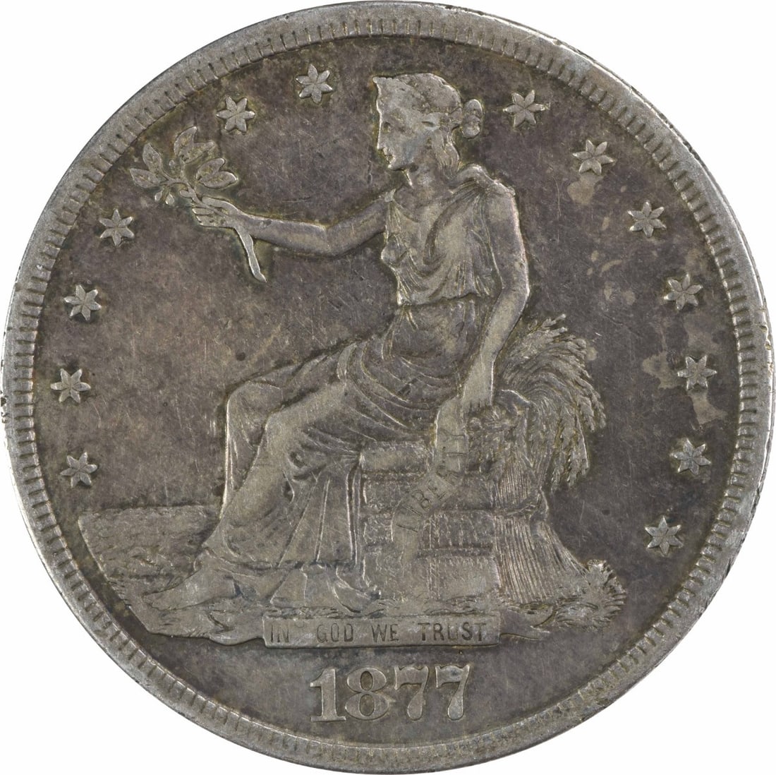 1877-S Trade Dollar XF Uncertified San Francisco Minted Silver Coin: 1877-S Trade Dollar XF Uncertified San Francisco Minted Silver Coin This 1877-S Trade Silver Dollar is a remarkable piece of numismatic history, featuring a design by William Barber. Minted in San Fra