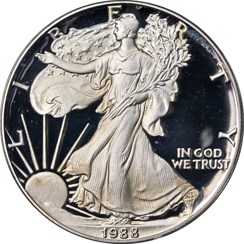 PCGS PR69 DCAM 1988-S Silver Eagle Dollar Proof Coin: PCGS PR69 DCAM 1988-S Silver Eagle Dollar Proof Coin This 1988-S Silver American Eagle $1 coin is certified by PCGS as PR69 DCAM, indicating a deep cameo proof with exceptional luster and a strong str