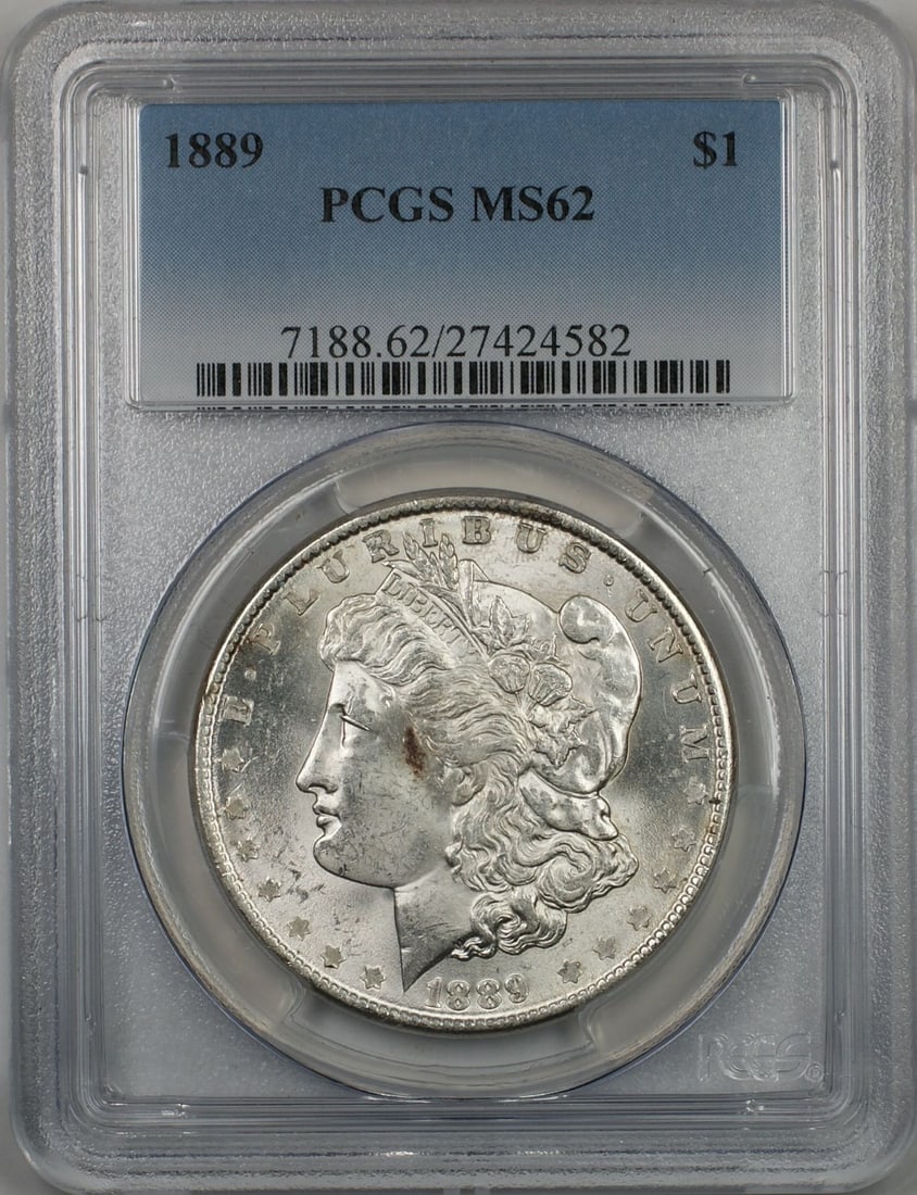 PCGS MS62 1889 Silver Morgan Dollar Coin Philadelphia Mint: PCGS MS62 1889 Silver Morgan Dollar Coin Philadelphia Mint This 1889 Morgan Silver Dollar is certified by PCGS and graded MS-62, indicating a better quality uncirculated coin. Minted in Philadelphia,