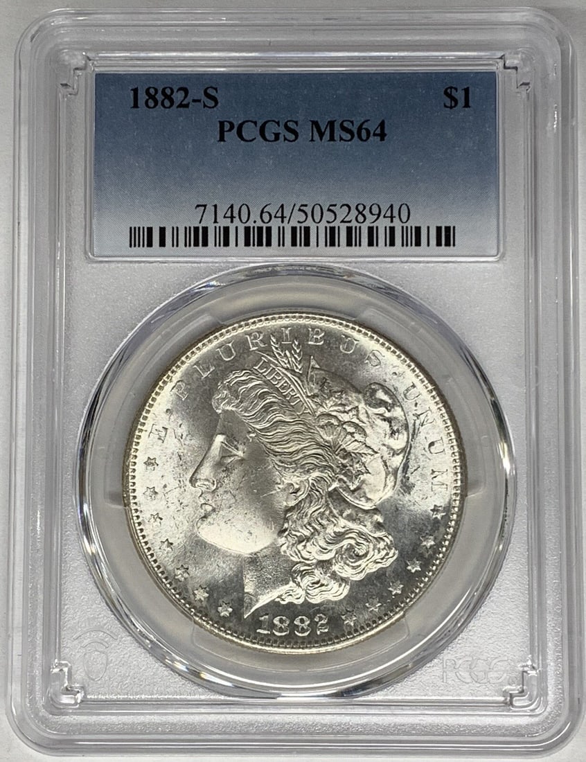 PCGS MS 64 Graded 1882-S Morgan Dollar Silver Coin: PCGS MS 64 Graded 1882-S Morgan Dollar Silver Coin This 1882-S Morgan Silver Dollar is certified by PCGS with a grade of MS 64. Composed of silver, this uncirculated coin originates from the United St