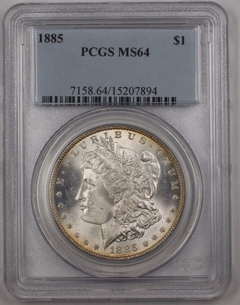 PCGS MS-64 1885 Morgan Silver Dollar Reverse Toning Uncirculated Coin: PCGS MS-64 1885 Morgan Silver Dollar Reverse Toning Uncirculated Coin This 1885 Morgan Silver Dollar $1 coin is graded MS-64 by PCGS and features attractive reverse toning. Struck in Philadelphia, it