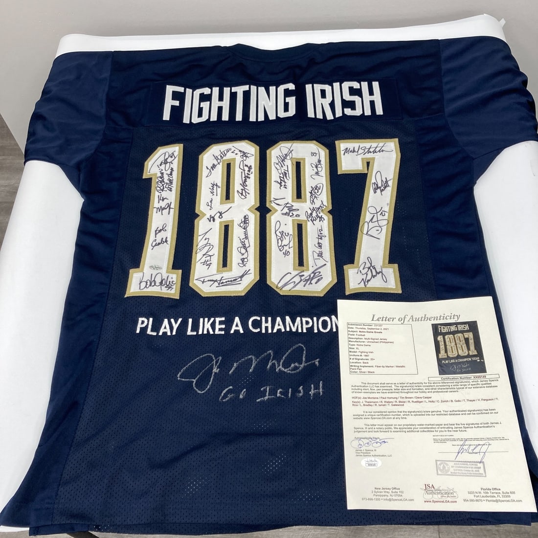 JSA Authenticated Notre Dame Football Jersey Signed by 20 Legends Including Joe Montana: JSA Authenticated Notre Dame Football Jersey Signed by 20 Legends Including Joe Montana This Notre Dame Fighting Irish jersey is custom-made in size XL and features the signatures of over 20 legendary