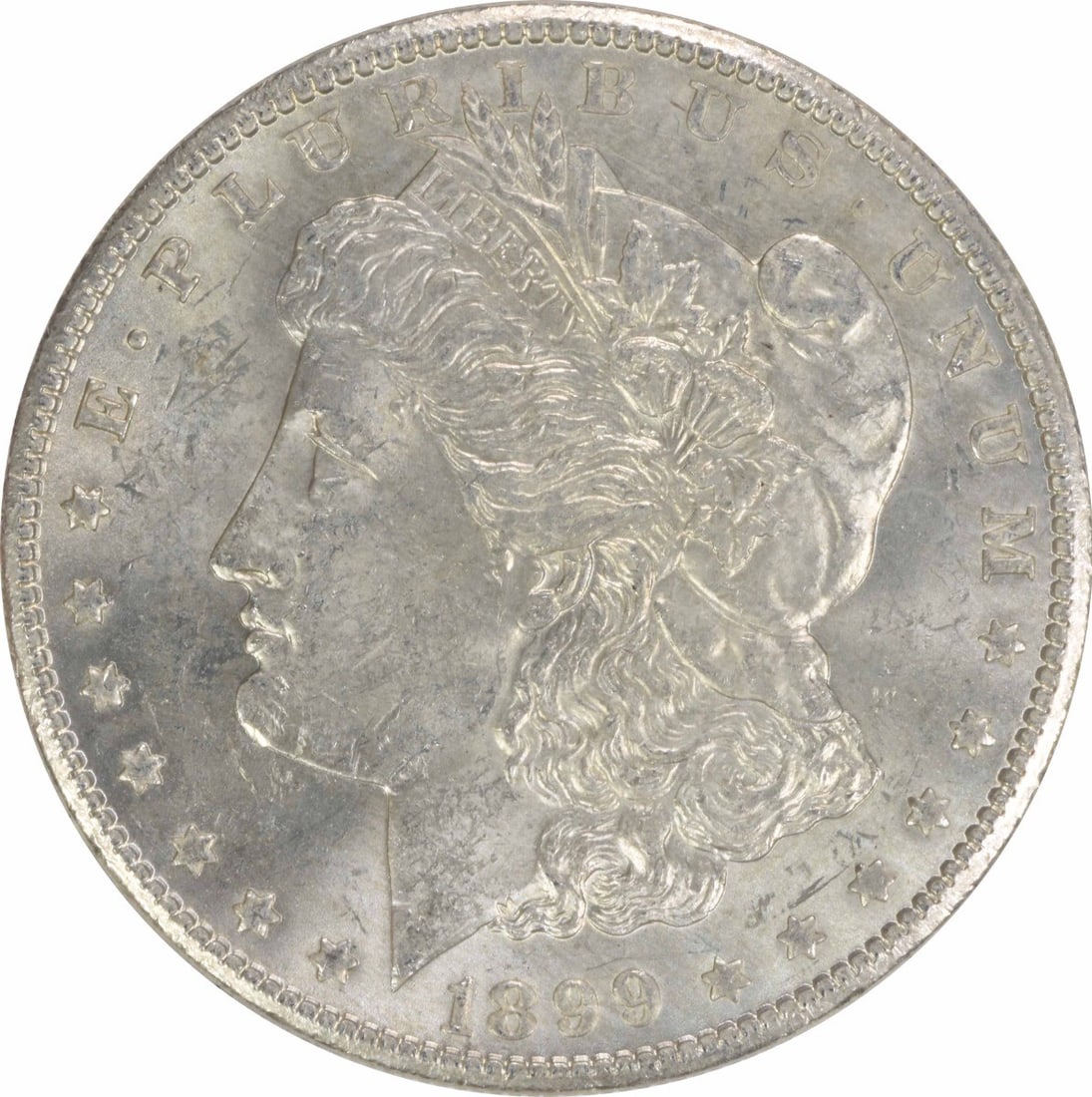 1899-O Morgan Silver Dollar BU Uncertified Coin: 1899-O Morgan Silver Dollar BU Uncertified Coin This 1899-O Morgan Silver Dollar is a stunning example of American coinage, showcasing beautiful uncirculated quality. Struck in silver, this coin featu