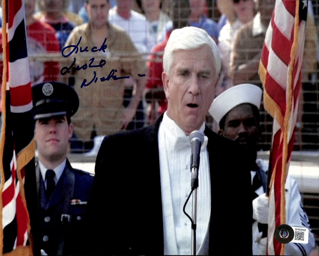 Leslie Nielsen Frank Drebin Signed 8x10 Photo with Inscription Beckett Certified: Leslie Nielsen Frank Drebin Signed 8x10 Photo with Inscription Beckett Certified This is an authentic 8x10 photograph signed by Leslie Nielsen, famously known for his role as "Frank Drebin" in the cla