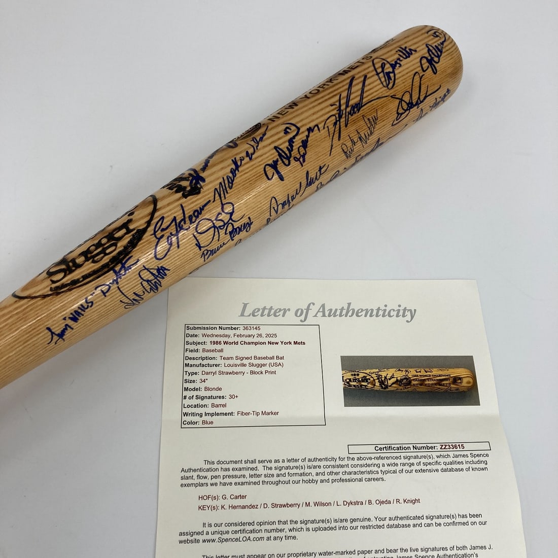 1986 New York Mets Team Signed Baseball Bat with JSA COA: 1986 New York Mets Team Signed Baseball Bat with JSA COA Celebrate the legacy of the 1986 World Champion New York Mets with this authentic team-signed baseball bat. This Louisville Slugger bat is auto