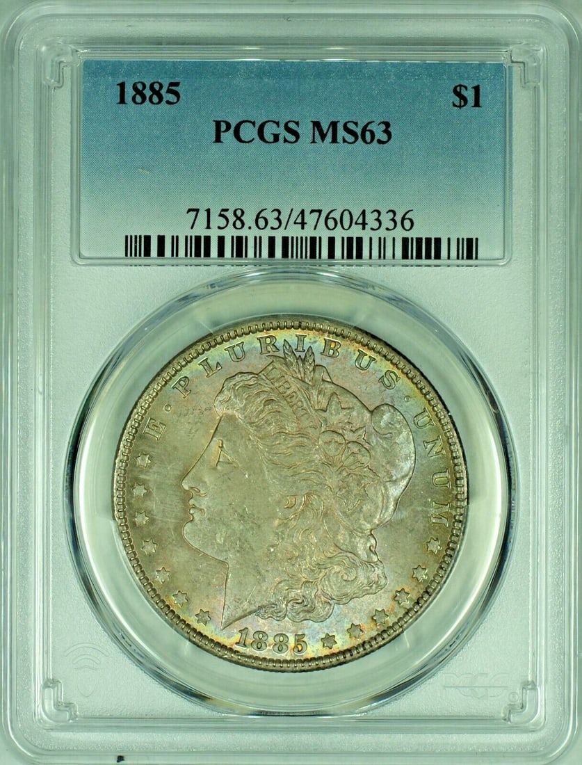PCGS MS 63 1885 Morgan Silver Dollar with Vivid Toning: PCGS MS 63 1885 Morgan Silver Dollar with Vivid Toning This is an 1885 Morgan Silver Dollar from the United States, featuring a colorful tone. The coin is uncirculated and has been graded MS 63 by PCG