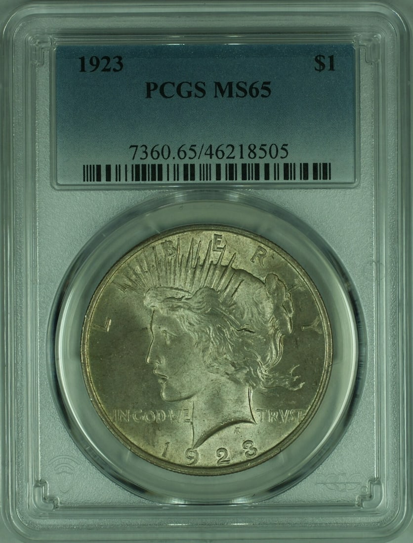 PCGS MS65 1923 Peace Dollar Silver Coin Lightly Toned Philadelphia Mint: PCGS MS65 1923 Peace Dollar Silver Coin Lightly Toned Philadelphia Mint This is a 1923 Peace Silver Dollar graded MS-65 by PCGS. The coin is uncirculated and features light toning. It was minted in Ph