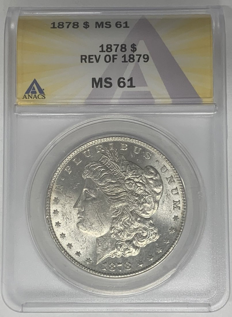 1878 Morgan Dollar Reverse of 79 Silver ANACS MS 61 Certified: 1878 Morgan Dollar Reverse of 79 Silver ANACS MS 61 Certified This is an 1878 Morgan Silver Dollar featuring the Reverse of 1879. The coin is composed of silver, has a denomination of $1, and originat