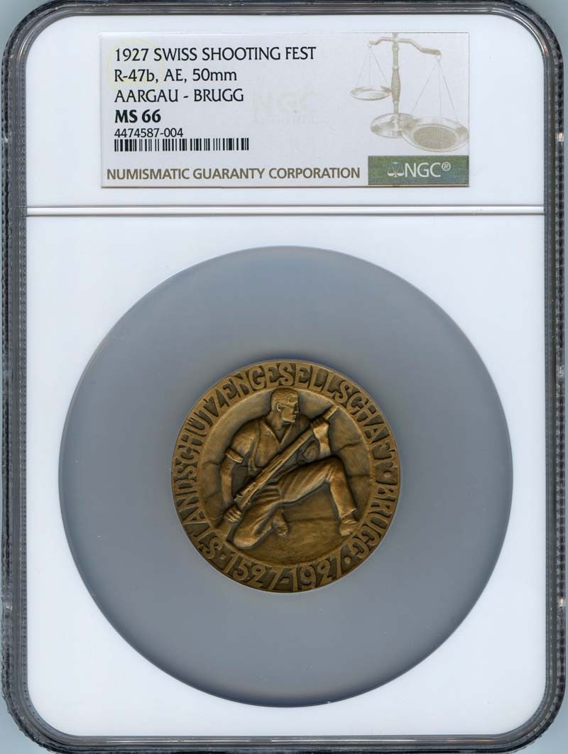 1927 Swiss Shooting Fest Coin NGC MS66 50MM Aargau-Brugg: 1927 Swiss Shooting Fest Coin NGC MS66 50MM Aargau-Brugg This 1927 Swiss Shooting Fest coin features a beautiful design celebrating the event held in Aargau-Brugg. Certified by NGC with a grade of MS6