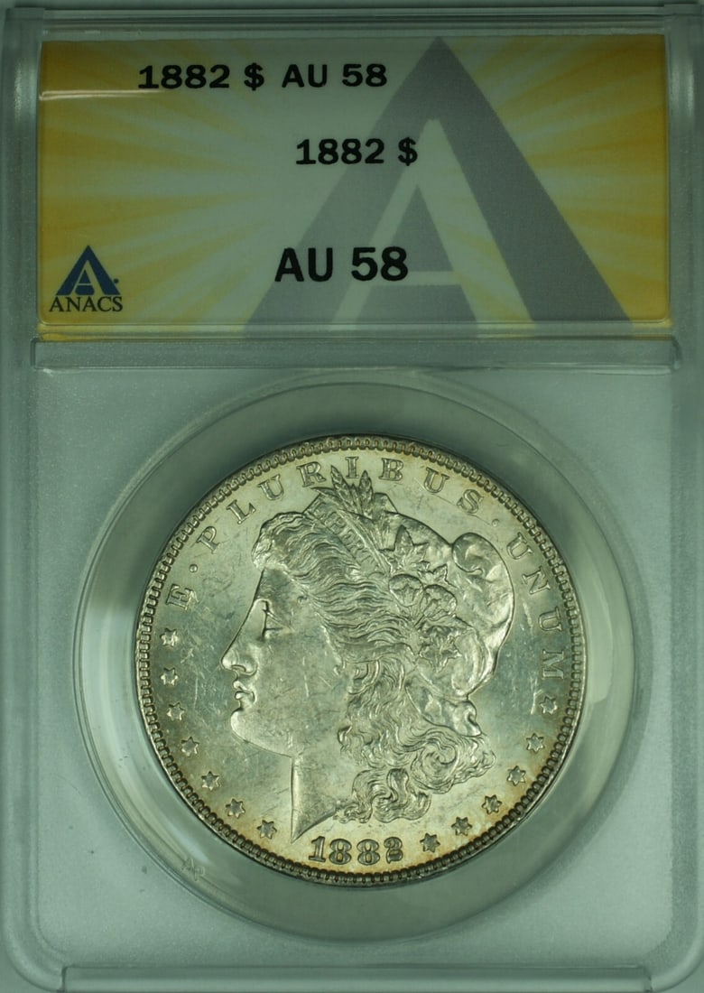 1882 ANACS AU 58 Morgan Dollar Silver Coin with Light Toning: 1882 ANACS AU 58 Morgan Dollar Silver Coin with Light Toning This is an 1882 Morgan Silver Dollar graded AU-58 by ANACS, featuring light toning. The coin was struck at the Philadelphia Mint and is com