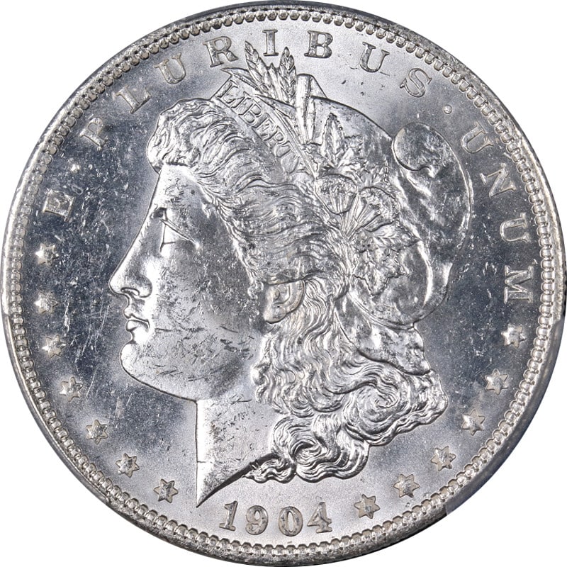 1904-O Morgan Silver Dollar PCGS MS63 Blast White Uncirculated: 1904-O Morgan Silver Dollar PCGS MS63 Blast White Uncirculated This stunning 1904-O Morgan Silver Dollar is certified by PCGS with a grade of MS63, showcasing superb eye appeal and a captivating blast